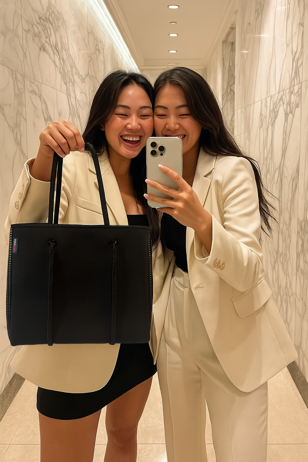 Woman carrying lightweight neoprene handbag